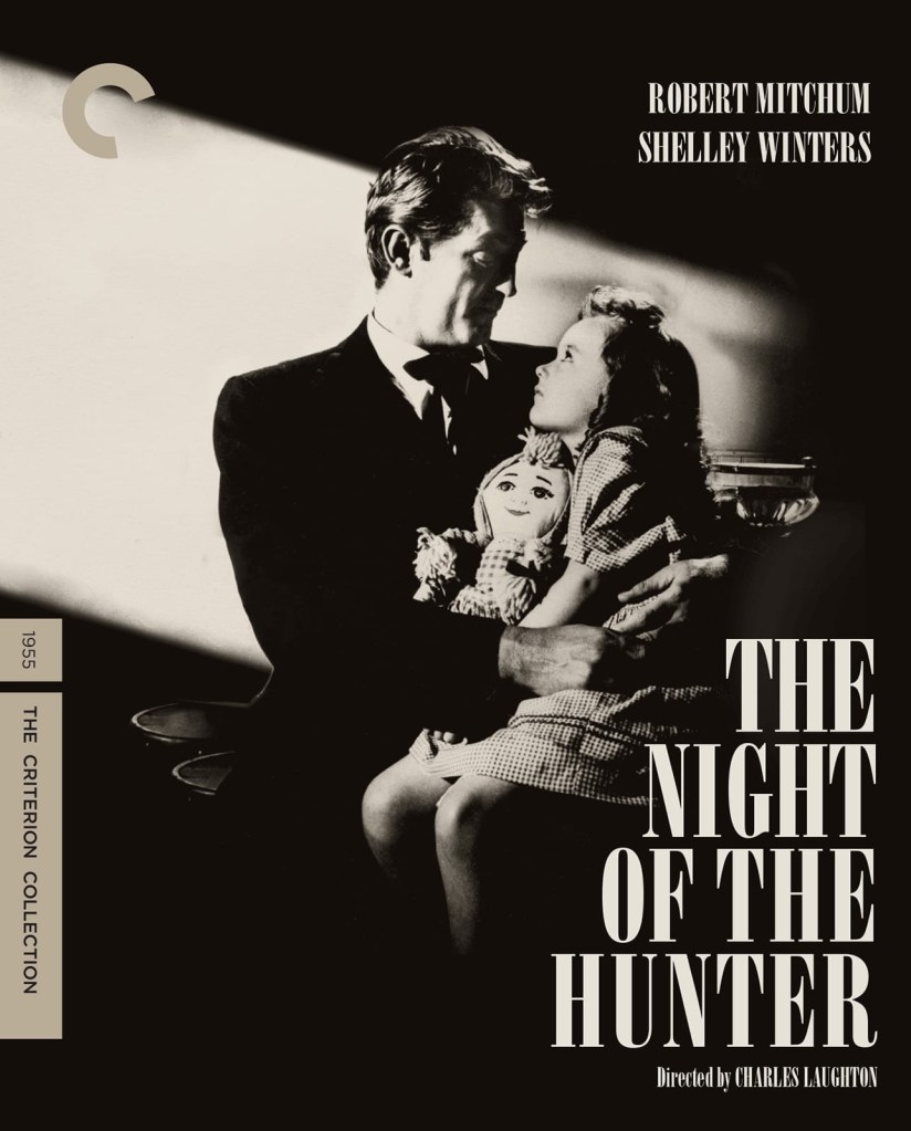 The movie poster for "The Night of the Hunter" shows Robert Mitchum holding a small girl clutching a rag doll, with light streaming in to illuminate the pair in a dark room.
