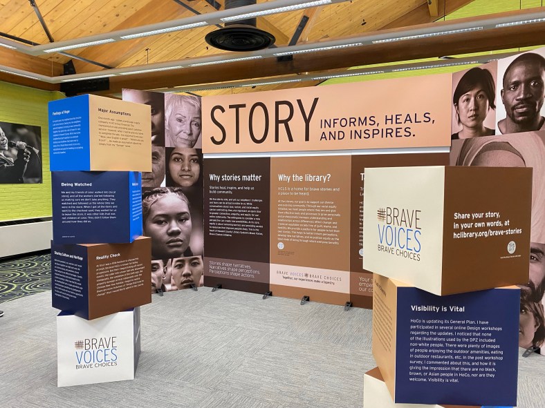 View of Brave Voices display at Central Branch, header read Story informs, heals, and inspires.