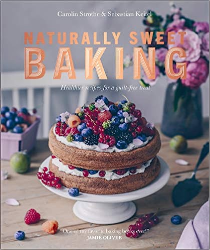 The cover depicts a cake or tart of two layers, on a white cake stand and covered with raspberries, blackberries, and blueberries. A pie server sits next to it on a wooden table, and in the background are a pint container of additional berries and a blue glazed ceramic picture filled with greens and pink rose blossoms.