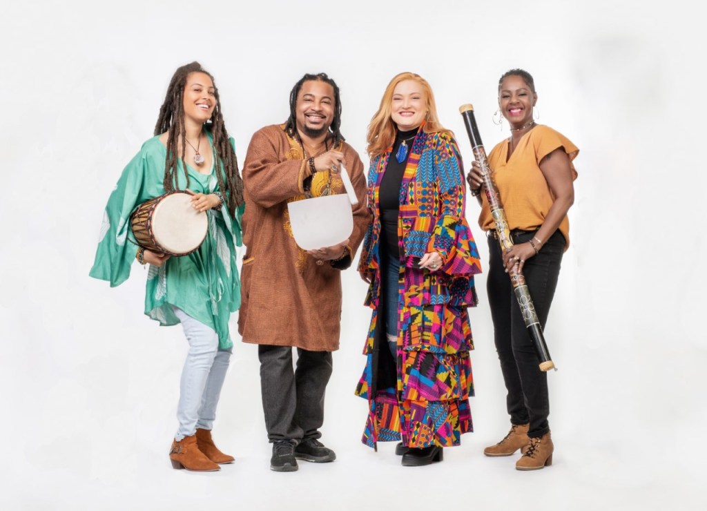 Members of the Healing Flame Collective posing with their instruments.