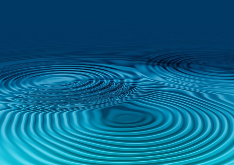 Blue water with circular waves overlapping.
