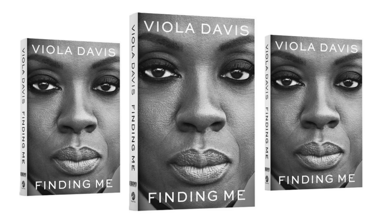 Three copies of Viola Davis' memoir, Finding Me, which feature a close up of her face.