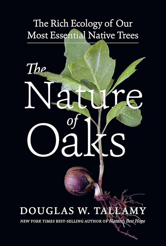 A black cover features a clear photograph of a sprouting acorn with a set of oak leaves.