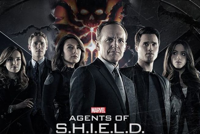 The main characters of Agesnts of SHIELD posed with Phil Coulson at the cneter and the Hydra symbol behind them.