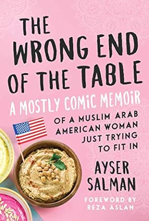 The book cover shows a wooden bowl of hummus topped with chickpeas and cilantro, with an American flag on a toothpick poking out of the bowl at the side.