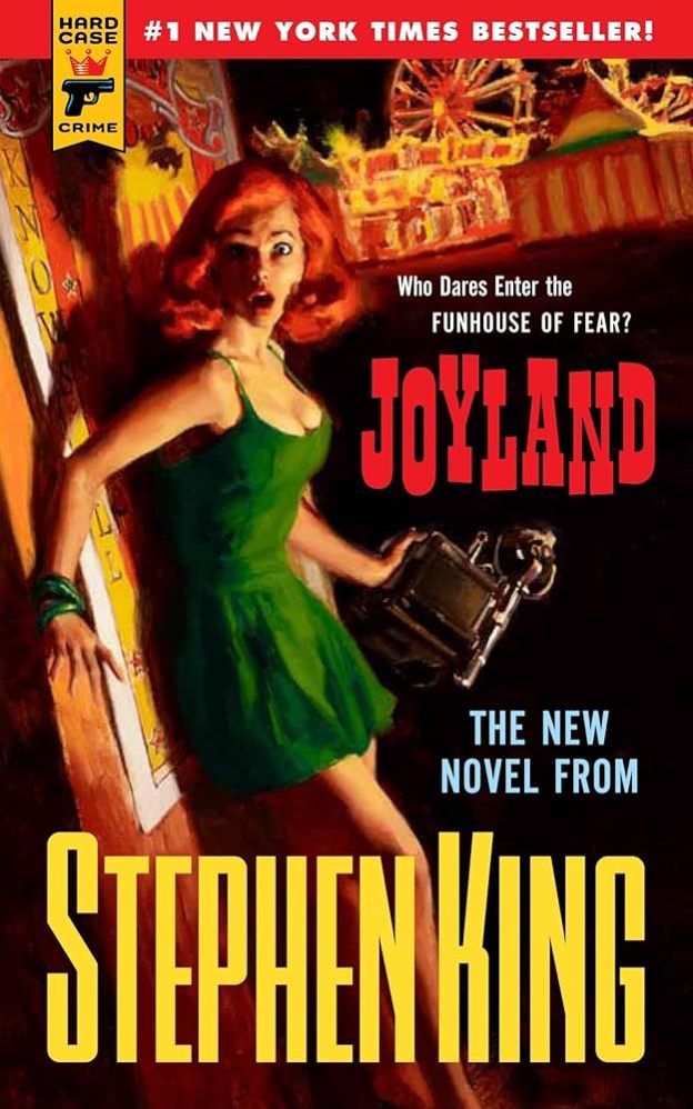 In the vein of old pulp covers, a red-haired woman (maybe a doll?) in a short green dress holds an old-fashioned square camera. She looks startled, and there's a carnival above and behind her.