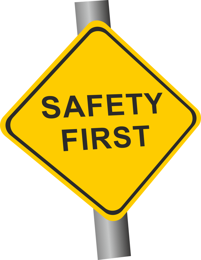 Yellow diamond shaped sign reads Safety First.