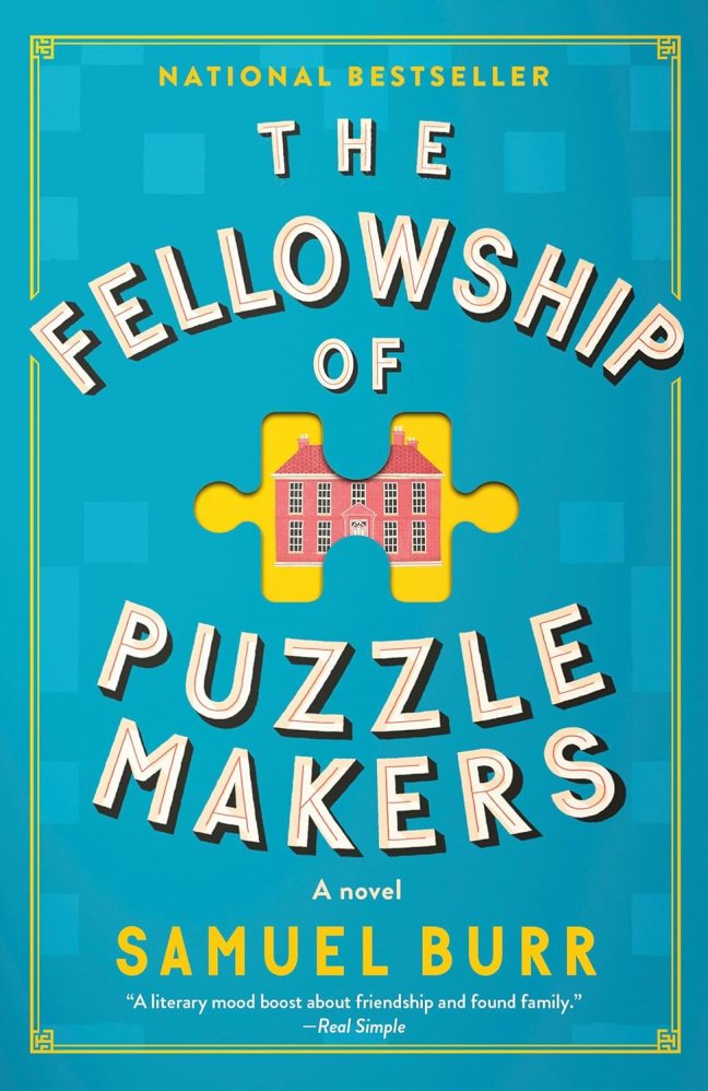 The book shows a mansion with ten windows and several chimneys, displayed inside a puzzle piece.